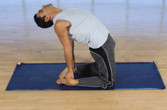 man-doing-yoga-mat-29656087